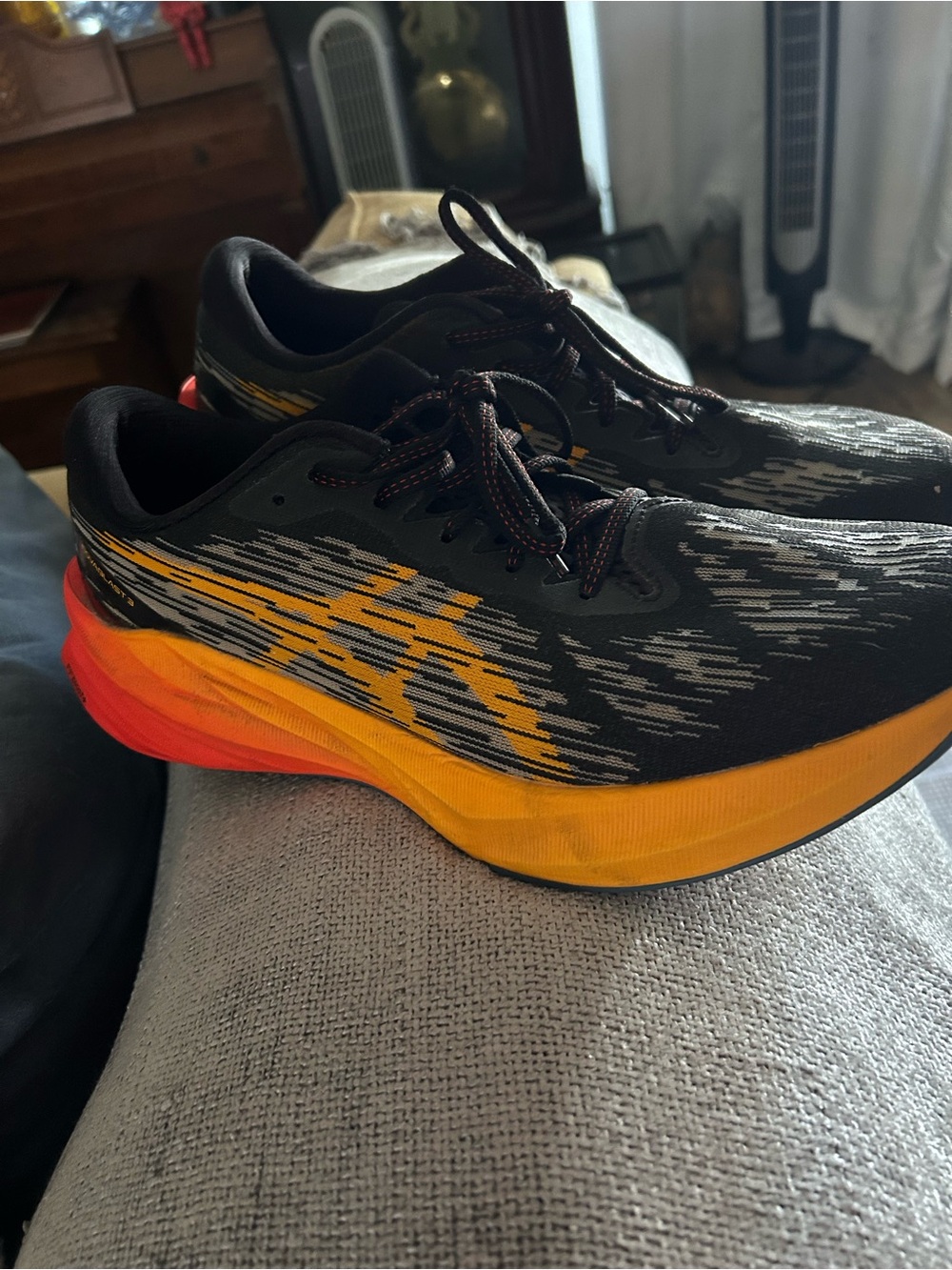 Men's Black ASIC  NOVABLAST running shoe.